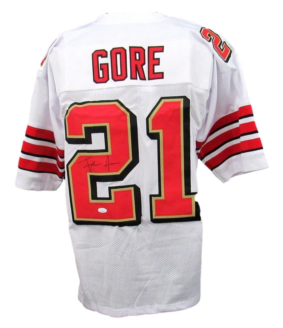 White Custom Signed Jersey Autographed By Gore: White Custom Signed Jersey Autographed By Gore Authentic and officially verified by James Spence Authentication (JSA), this white custom signed jersey bears the unmistakable mark of football legend Go