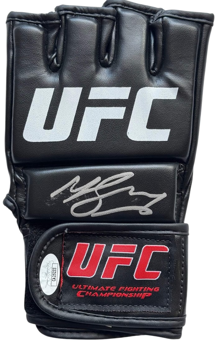 UFC Glove Signed By Michael Bisping: UFC Glove Signed By Michael Bisping The Michael Bisping UFC Champion Autographed Glove is an authentic collectible featuring a silver sharpie signature across its front. This unique piece of