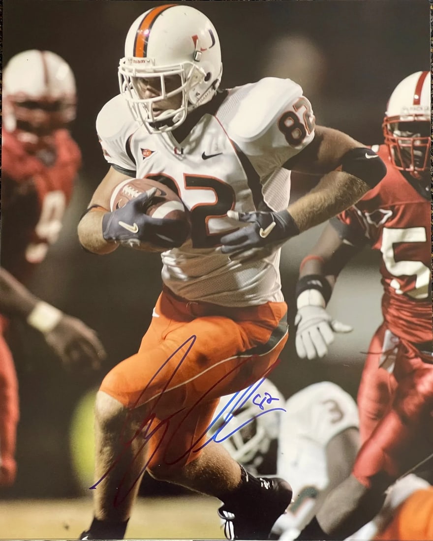 Strict rules apply to autograph: Strict rules apply to autograph Authentic Miami Hurricanes football photo signed in blue sharpie by Greg Olsen. This 16x20 photo features a clear and visible autograph across the front, accompanied