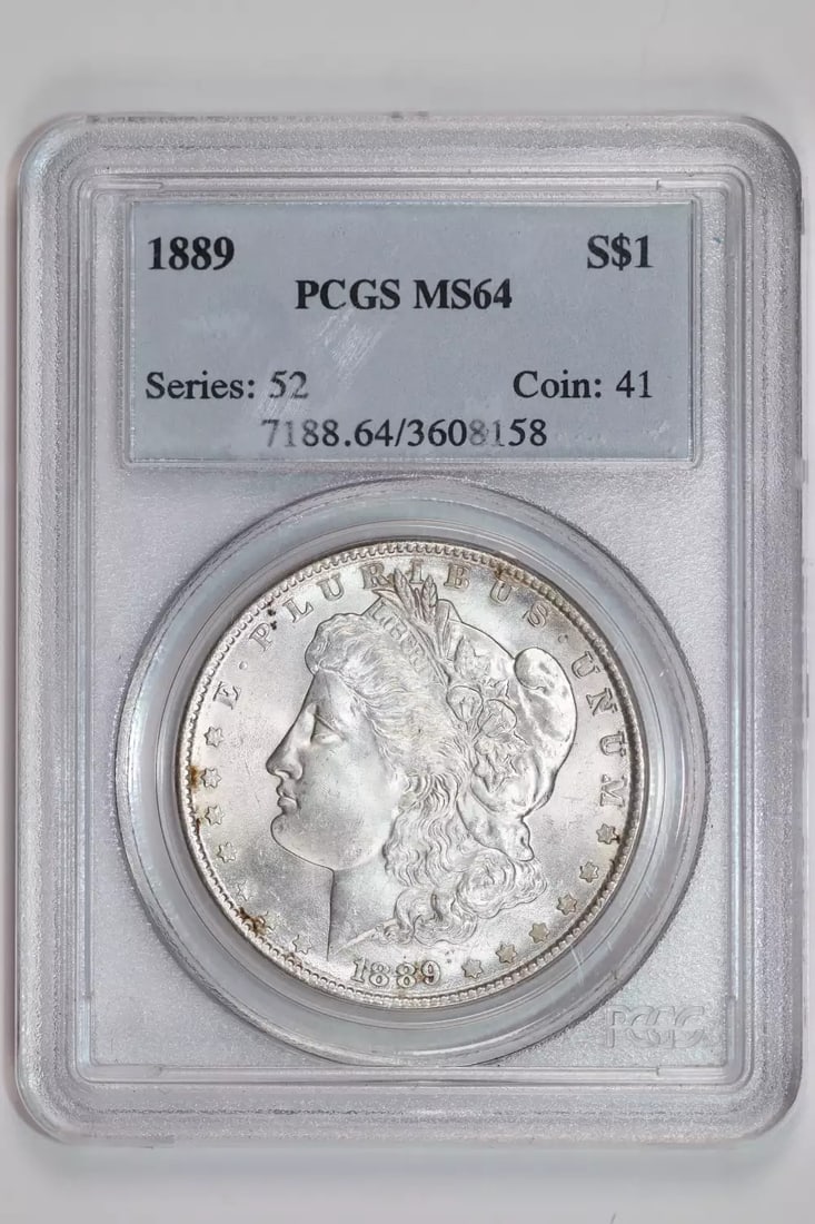 PCGS MS64 HOT 50 MORGAN DOLLAR DOUBLED EAR: PCGS MS64 HOT 50 MORGAN DOLLAR DOUBLED EAR The PCGS MS64 HOT 50 Morgan Dollar features a striking doubled ear, making it a standout among circulated dollars. Certified by PCGS as an MS64, this coin