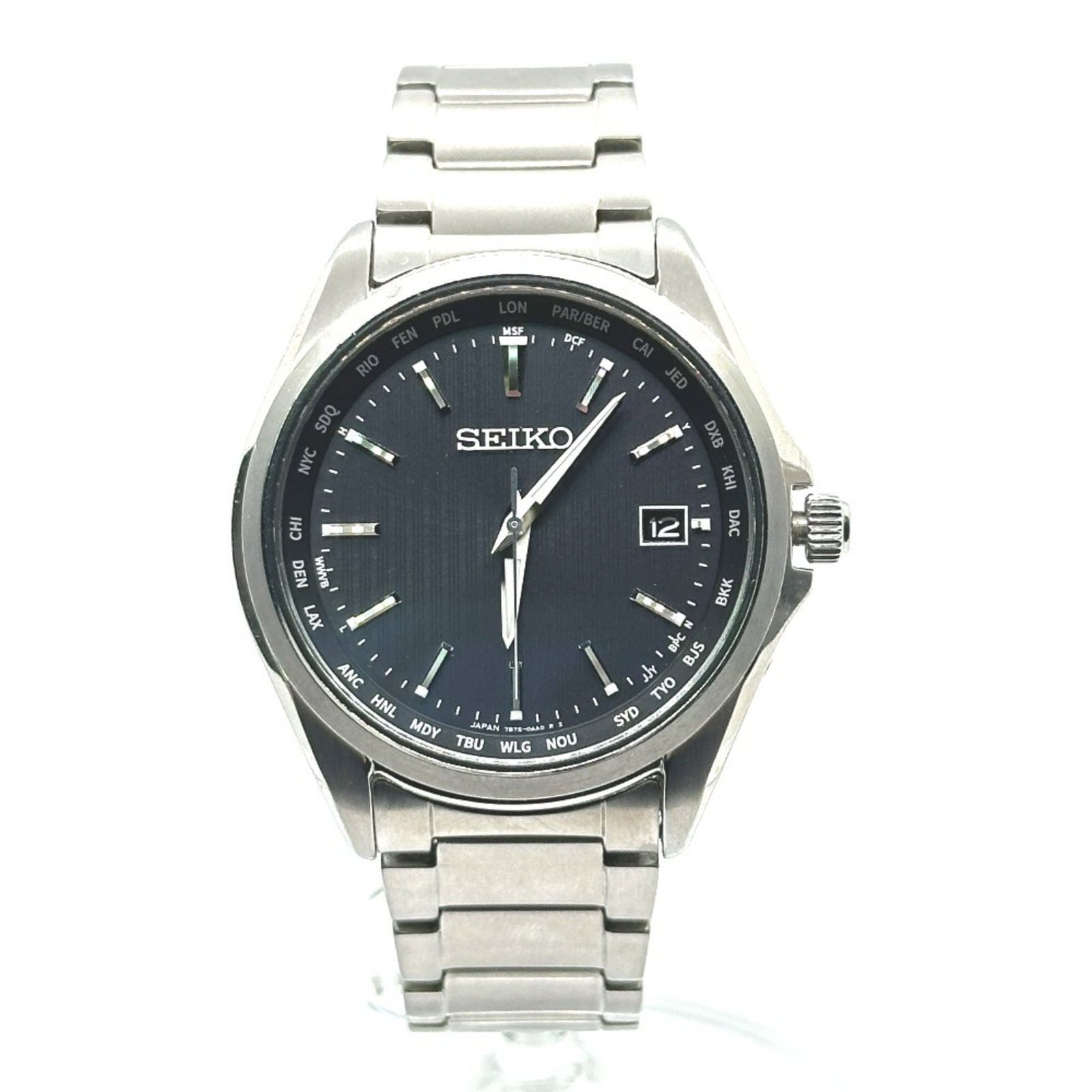 Wristwatch by Seiko: Wristwatch by Seiko This Seiko titanium wristwatch boasts a sleek silver case and black dial, with a durable 38mm design suitable for everyday wear. The watch features a comfortable 18mm wide band