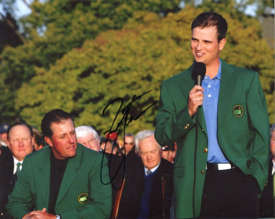 Johnson Zach Autographed 8x10 Photo: Johnson Zach Autographed 8x10 Photo Authentic Zach Johnson Autographed 8x10 Photo. This photo captures Zach's triumphant moment after winning the Masters Golf Tournament, bearing his signature in blac