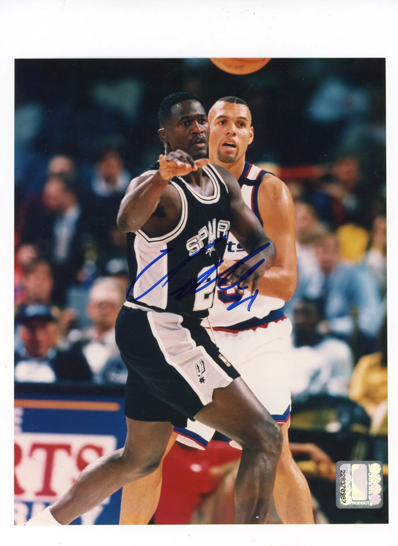 Wilkins Dominique Autographed Photo: Wilkins Dominique Autographed Photo The Wilkins Dominique Autographed Photo features an 8x10 photo signed in blue sharpie across the picture by Dominique Wilkins. This unique item showcases a notable 