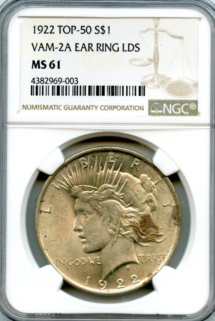MS61 PEACE DOLLAR 50 TOP LDS EARRING NGC 1922 VAM-2A C7712: MS61 PEACE DOLLAR 50 TOP LDS EARRING NGC 1922 VAM-2A C7712 The MS61 PEACE DOLLAR 50 Top LDS Earring features a striking design with a unique top lid error. Certified by NGC and graded MS61, this coin