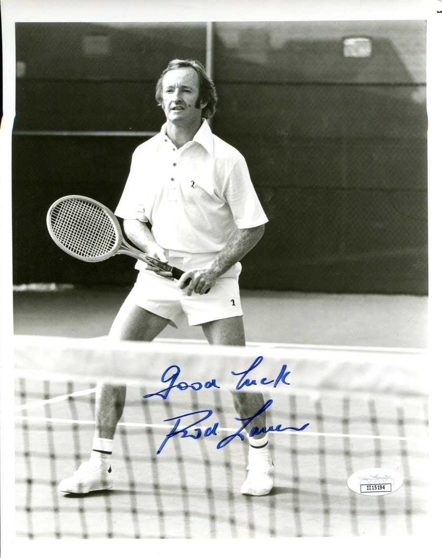 Strict Rules Apply: Strict Rules Apply Authentic Rod Laver Autographed 8x10 Photo. This James Spence Authentication (JSA) certified photo features a blue sharpie signed across the front by tennis legend Rod Laver, accomp