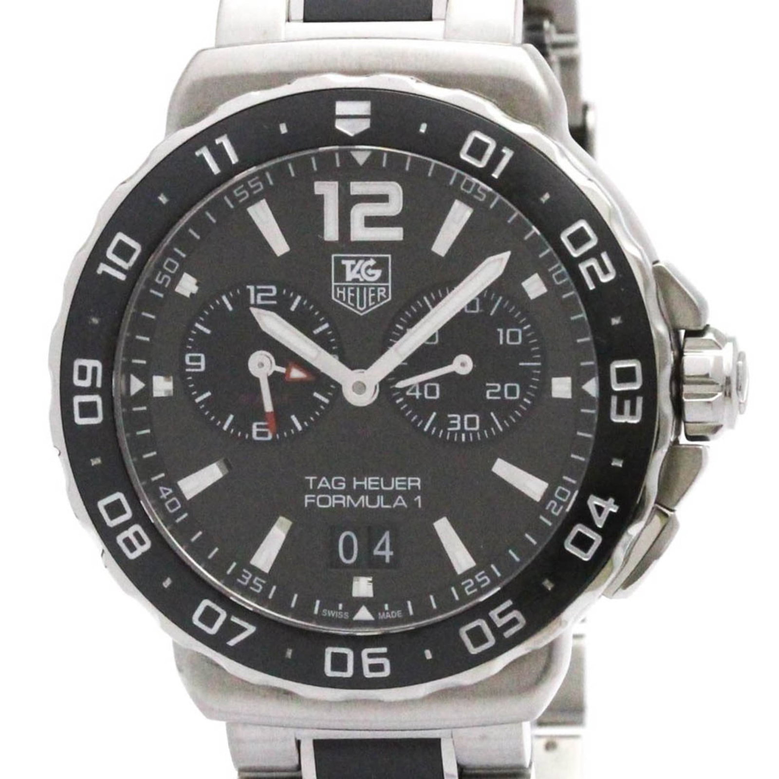 Heuer Watch Tag: Heuer Watch Tag Stainless steel case and band provide a durable foundation for this sporty wristwatch. The gray dial adds a touch of sophistication to its sporty design, making it a versatile timepiec