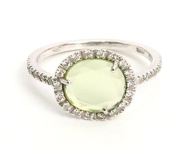 Colpo di Fulmine Prasiolite Diamond Ring 18k White Gold with Paper: Colpo di Fulmine Prasiolite Diamond Ring 18k White Gold with Paper 18k White Gold ring with a stunning oval Prasiolite diamond at its center. This elegant piece features an engraved design and is set