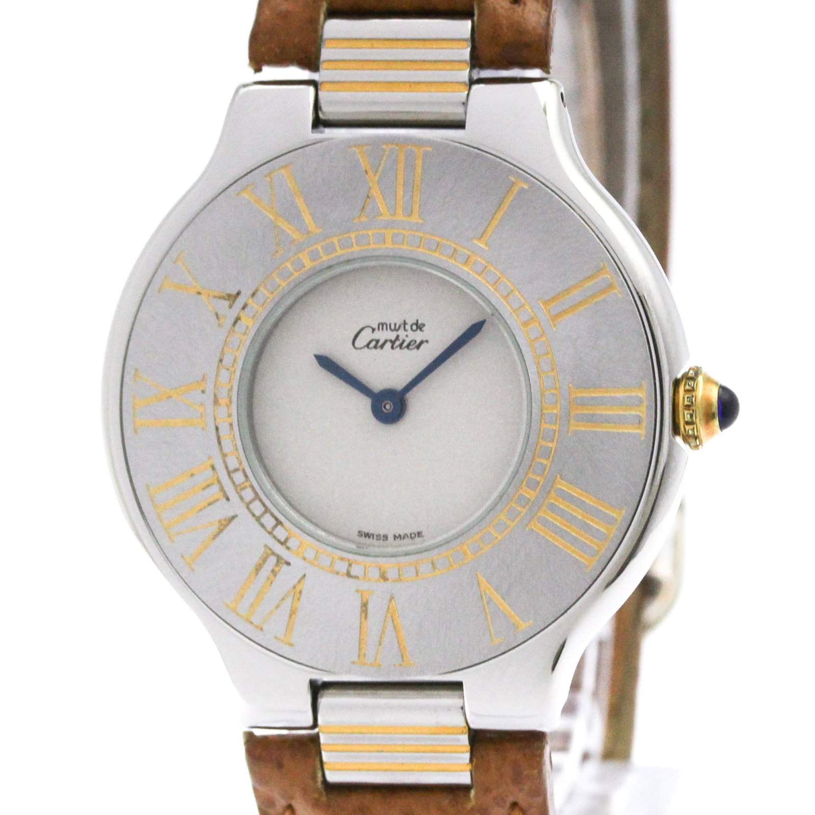 Watch Cartier: Watch Cartier Cartier watch with gold plated case and stainless steel band, featuring a silver dial and leather strap. The 31mm timepiece has some traces of usage, scratches, and dirt, indicating