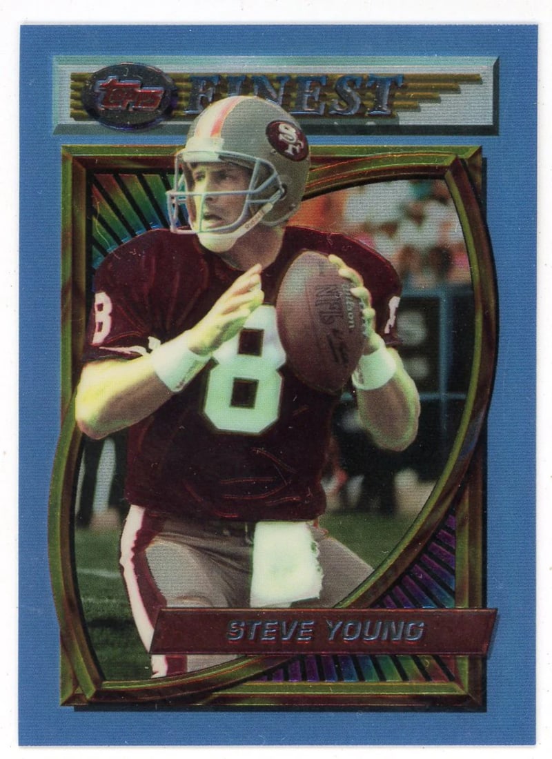Young 1994 Finest Topps #77: Young 1994 Finest Topps #77 The Panini Steve Young 1994 Topps Finest #77 features a vibrant portrait of the legendary quarterback, showcasing his impressive athletic build and determined expression.