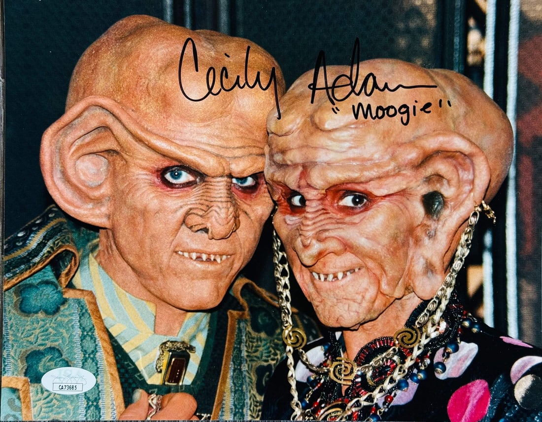 Strict rules apply to autographed celebrity photo: Strict rules apply to autographed celebrity photo This autographed celebrity photo features a sharpie signature across the front from Cecily Adams in black ink with the inscription "Moogie". The 8x10 