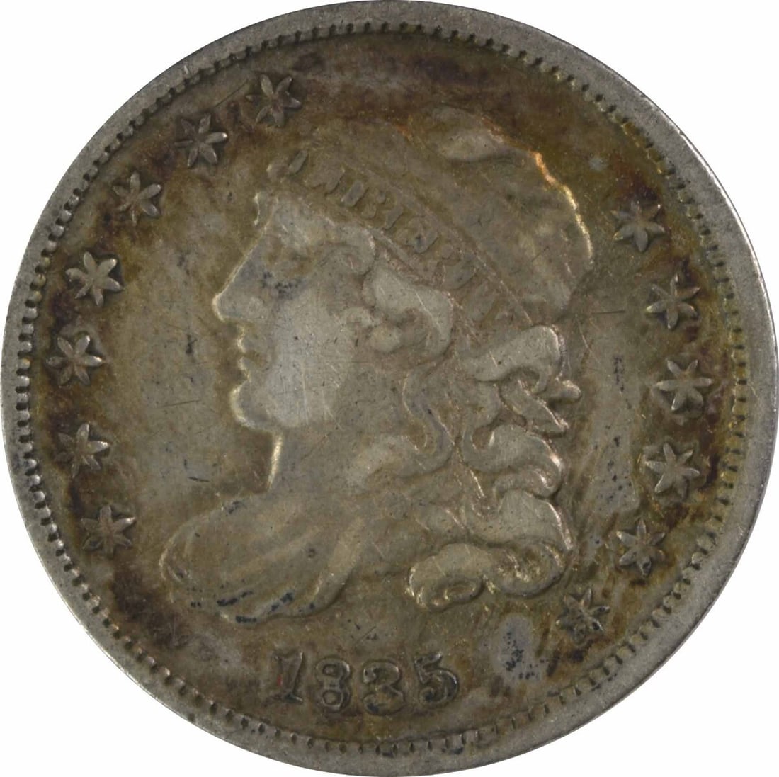 Uncertified silver half dime from bust of 1835: Uncertified silver half dime from bust of 1835 The 1835 Capped Bust Half Dime features an iconic design from William Kneass, with its reeded edge and silver composition. This circulated coin has been 