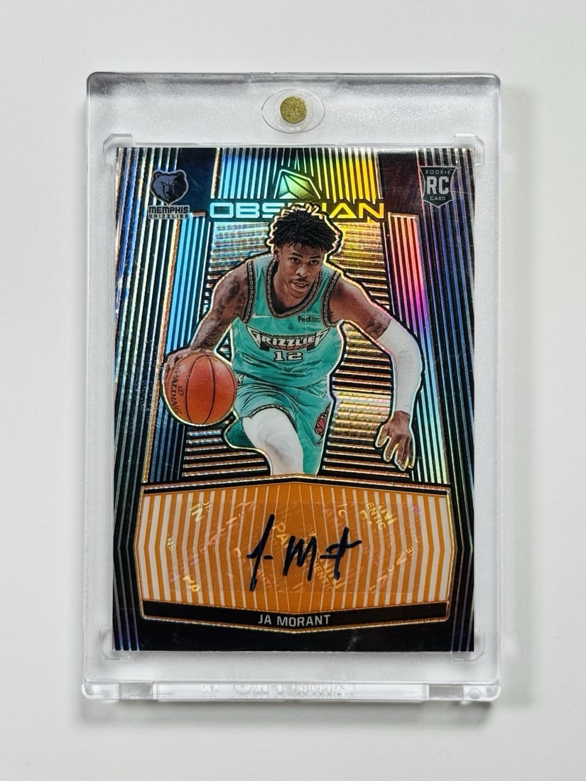OBSIDIAN PANINI 2020 50 electric etch rookie/ orange Ja Morant # RA JMT: OBSIDIAN PANINI 2020 50 electric etch rookie/ orange Ja Morant # RA JMT Electric Etch Orange Panini Card #RA-JMT features a unique design and a rare rookie card from Ja Morant's 2019-20 season. This