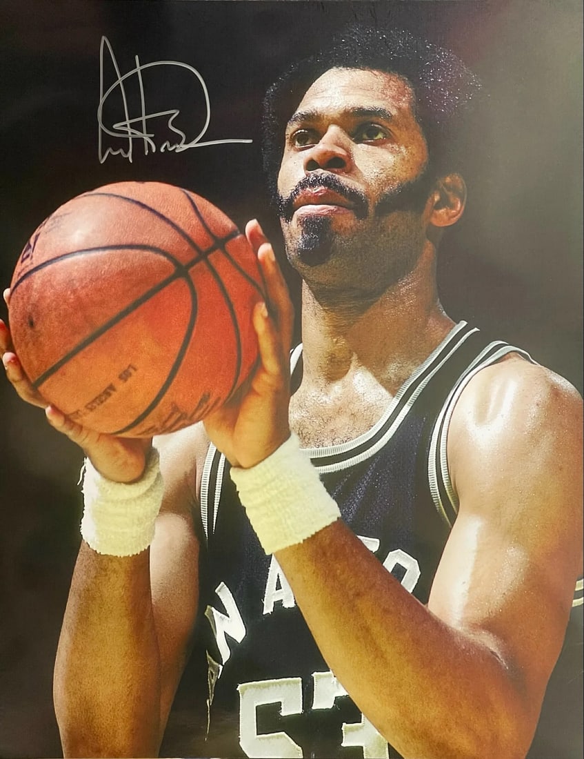 Gilmore Autographed Basketball Photo: Gilmore Autographed Basketball Photo The Gilmore Autographed Basketball Photo features an 16x20 inch photo of Artis Gilmore signed in silver harpie across the front. This unique piece showcases
