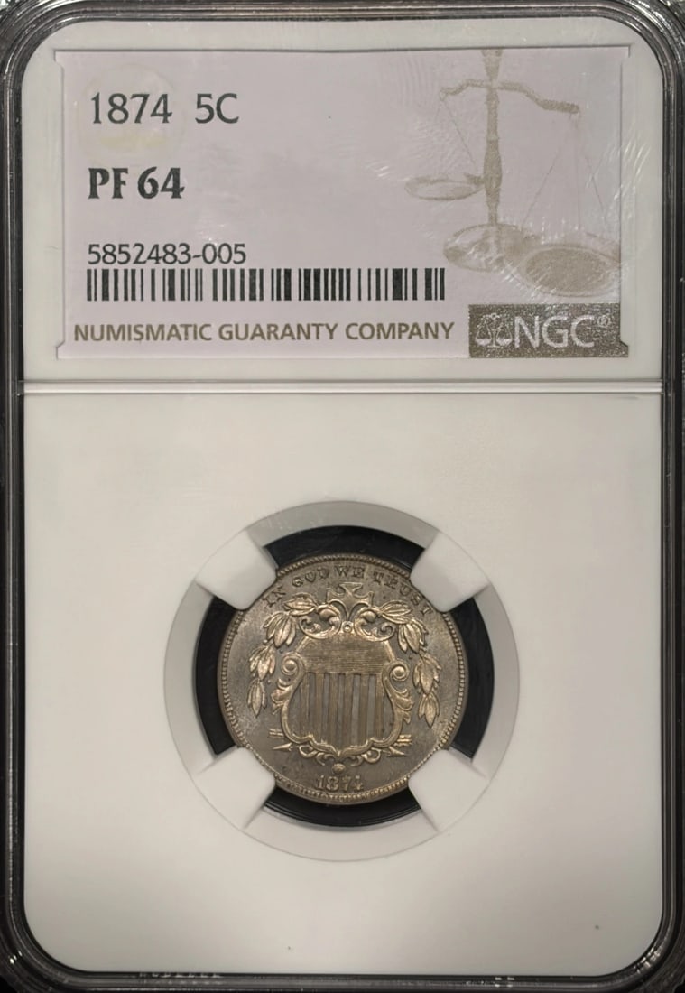 PROOF SHIELD NICKEL 1874 NGC PR64: PROOF SHIELD NICKEL 1874 NGC PR64 The Proof Shield Nickel 1874 NGC PR64 is a highly detailed and intricately designed coin featuring a striking proof finish. Certified by the Numismatic Guaranty Corpo