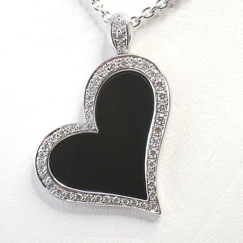 Heart of Onyx Diamond Necklace 18k White Gold Pendant: Heart of Onyx Diamond Necklace 18k White Gold Pendant 18k White Gold Heart Pendant with Natural Onyx and Diamond Accents. This elegant necklace features a heart-shaped pendant closure adorned with a n