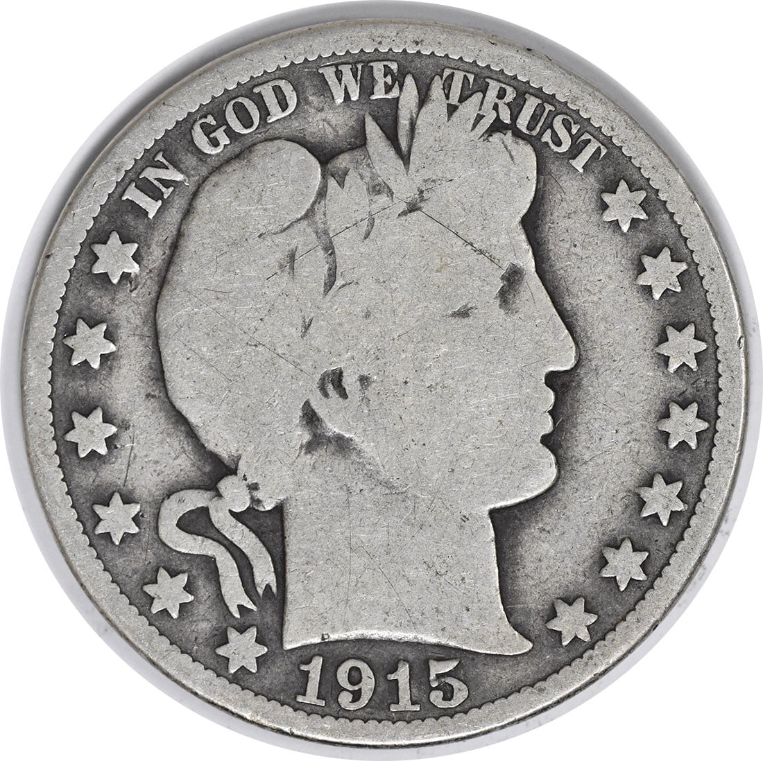 Uncertified silver half dollar of 1915: Uncertified silver half dollar of 1915 The 1915 Philadelphia silver half dollar boasts its distinctive reeded edge and classic Barber design. With a mintage of over 138,000 coins, this circulated piec