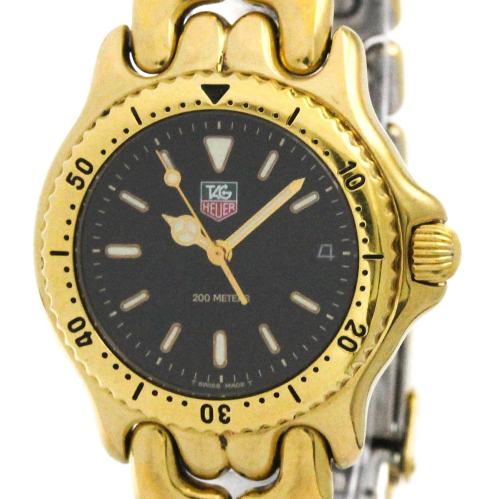 Wristwatch by Tag Heuer: Wristwatch by Tag Heuer Tag Heuer's gold plated wristwatch boasts a sleek black dial and sporty design, with a 34mm case diameter that fits comfortably on the wrist. The watch features a gold plated b