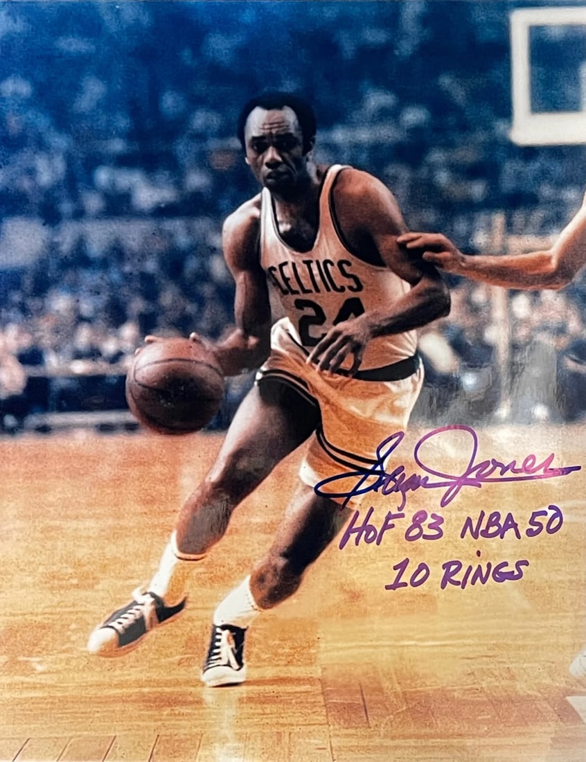 Sam Jones Autographed Basketball Photo: Sam Jones Autographed Basketball Photo Signed in blue sharpie across the front of an official 8x10 basketball photo, Sam Jones has added his personal touch to this iconic image. The photo bears a sign