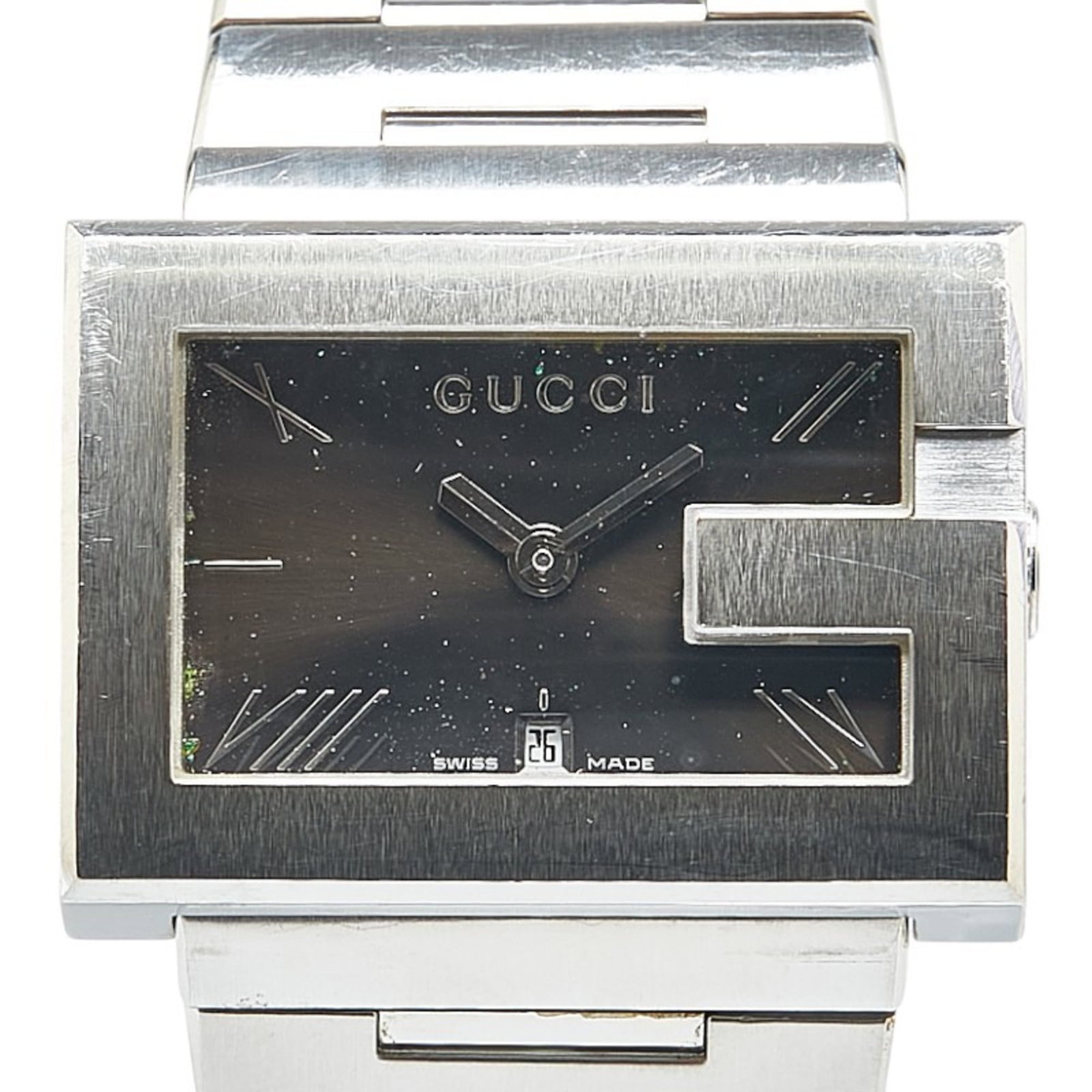 Gucci Wristwatch: Gucci Wristwatch Stainless steel case and band provide a sleek, modern look for the wearer. The black dial stands out against the neutral background, adding a touch of sophistication to the overall de