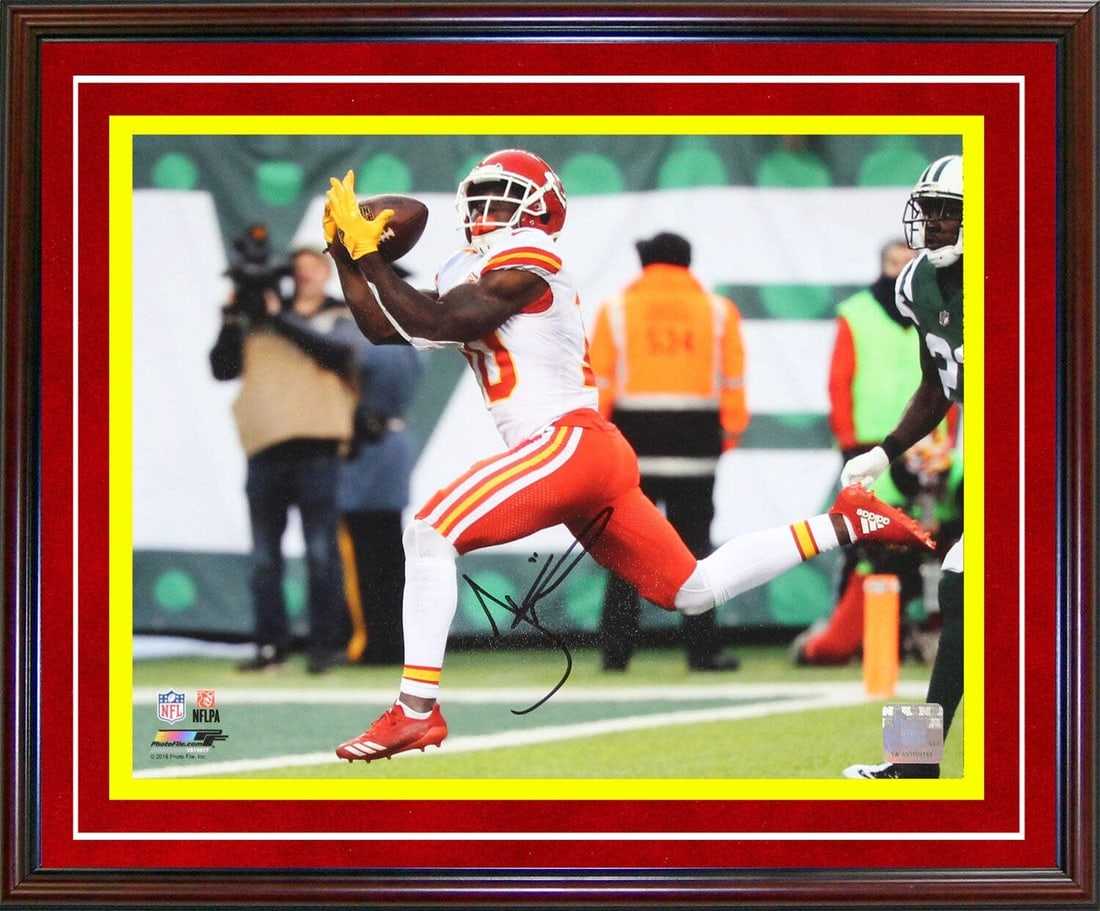 Hill Tyreek Autographed Framed Photo 11x14: Hill Tyreek Autographed Framed Photo 11x14 Tyreek Hill's dynamic pose in an action-packed catch is captured in this 11x14 framed photo, signed in black sharpie across the front. The image showcases th