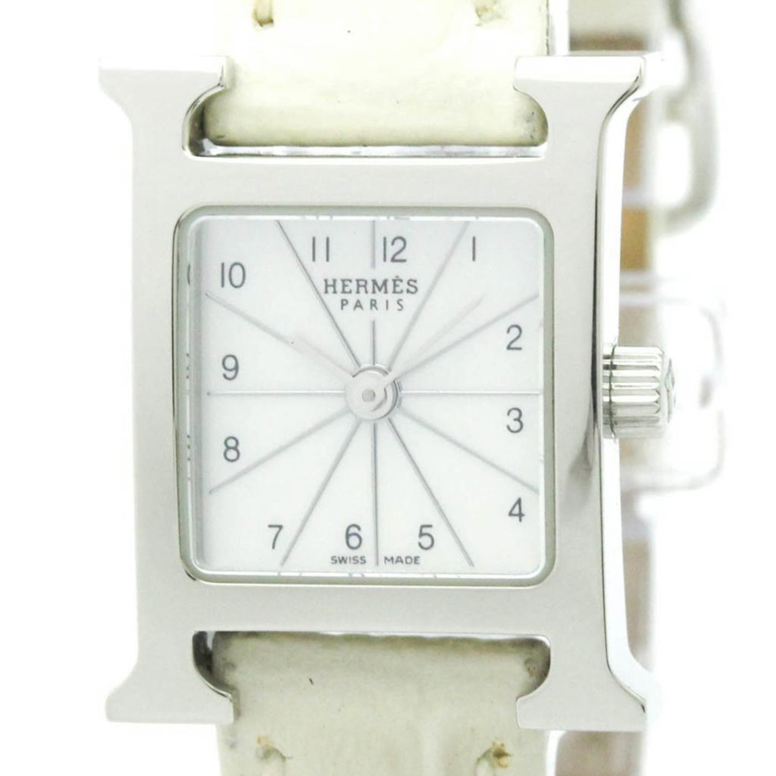 Hermes Wristwatch: Hermes Wristwatch Stainless steel case and white leather strap make for a sleek, elegant timepiece. This Hermes wristwatch boasts a classic design with subtle scratches and minor wear, giving it a wel