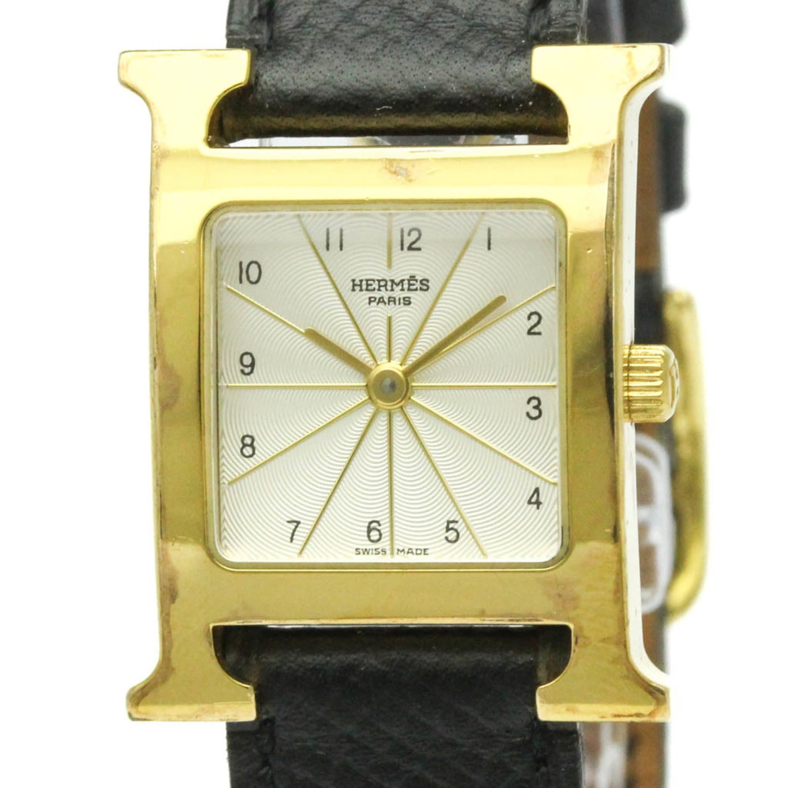 Hermes Wristwatch: Hermes Wristwatch Gold plated Hermes wristwatch with silver dial, featuring a classic dress/formal style. The 21mm case and leather band make for a timeless and elegant accessory. With traces of