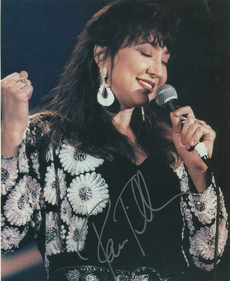 Pam Tillis Autographed 8x10 Celebrity Photo: Pam Tillis Autographed 8x10 Celebrity Photo Pam Tillis' iconic smile shines bright in this 8x10 celebrity photo, signed in silver across the front. The photo captures her unique charm and talent as a 