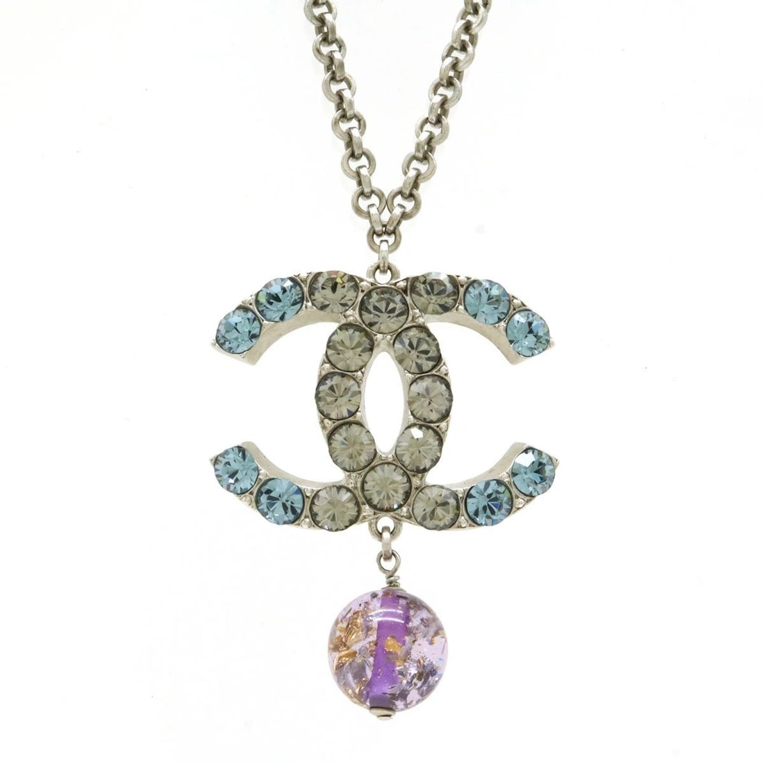 CHANEL 06 P Coco Mark CC Rhinestone Pendant Necklace 17.7 inches in Rare: CHANEL 06 P Coco Mark CC Rhinestone Pendant Necklace 17.7 inches in Rare Silver CHANEL 06 P Coco Mark CC Rhinestone Pendant Necklace, measuring 17.7 inches in length, features blue/purple main stones 