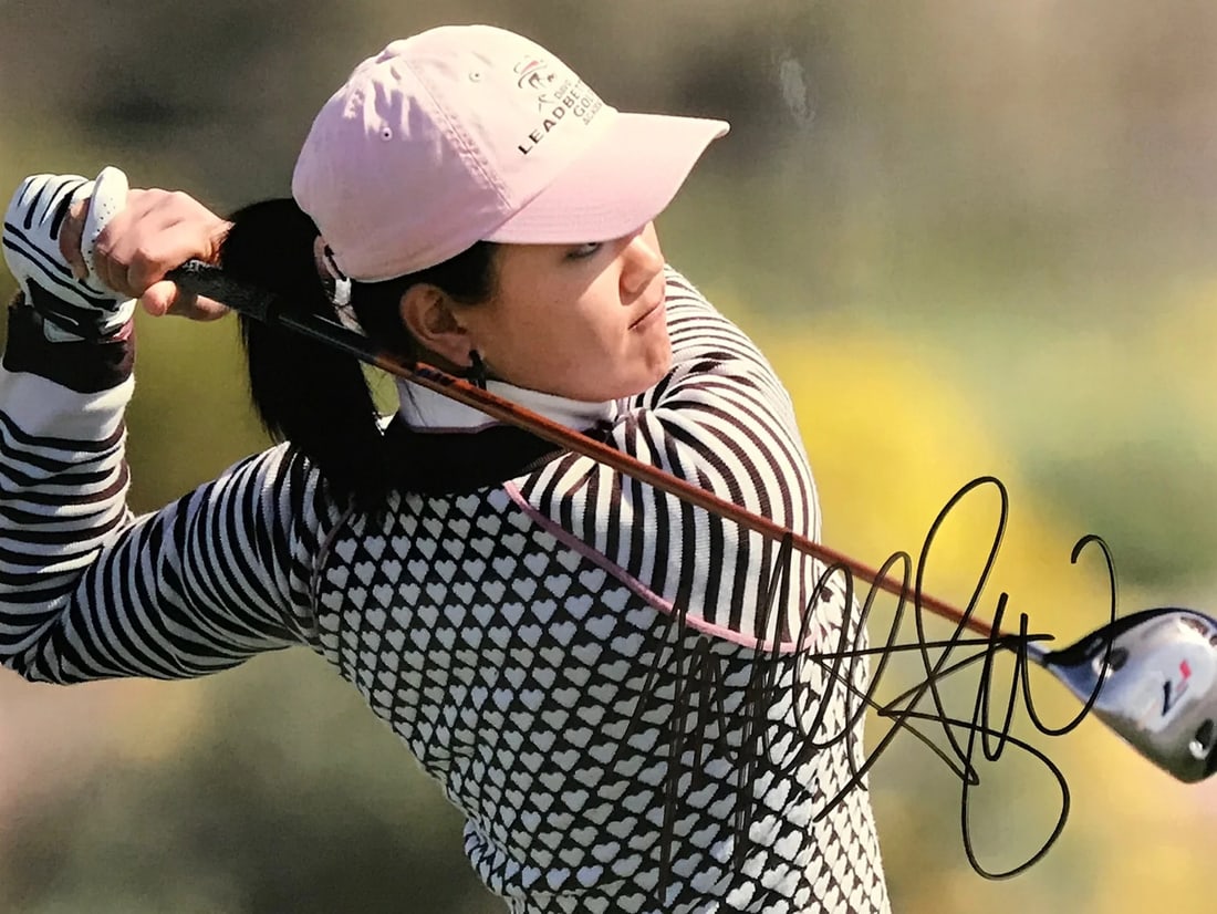 Michelle Wie Autographed Golf 8x10 Photo: Michelle Wie Autographed Golf 8x10 Photo Michelle Wie's sharpie signature adds a touch of personality to this 8x10 golf photo, capturing her dedication to the sport. The full-size image showcases her 