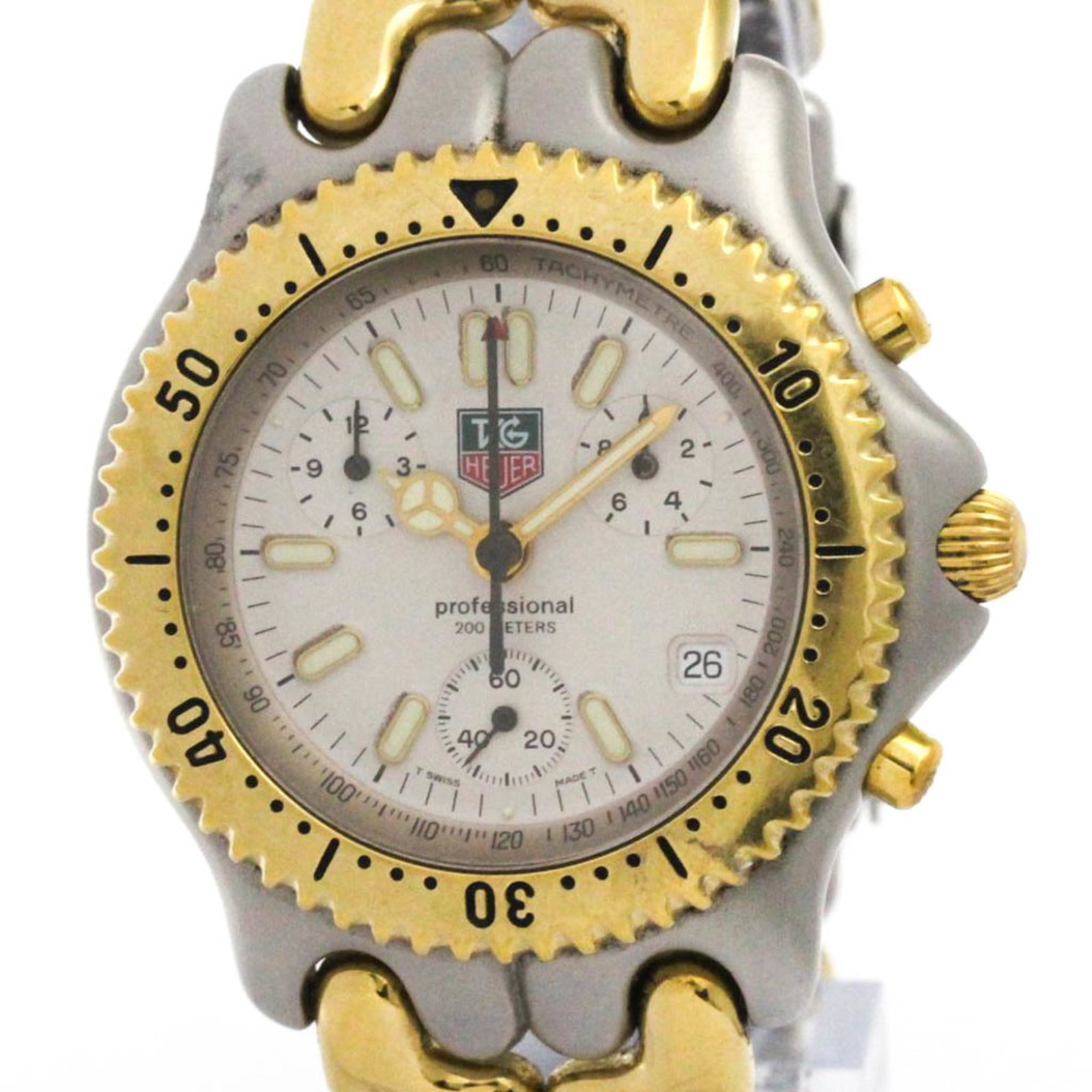 Wristwatch by Tag Heuer: Wristwatch by Tag Heuer The Tag Heuer wristwatch boasts a sleek, sporty design with a gold-plated case and stainless steel band. Its white dial adds a touch of elegance to the overall look, while its