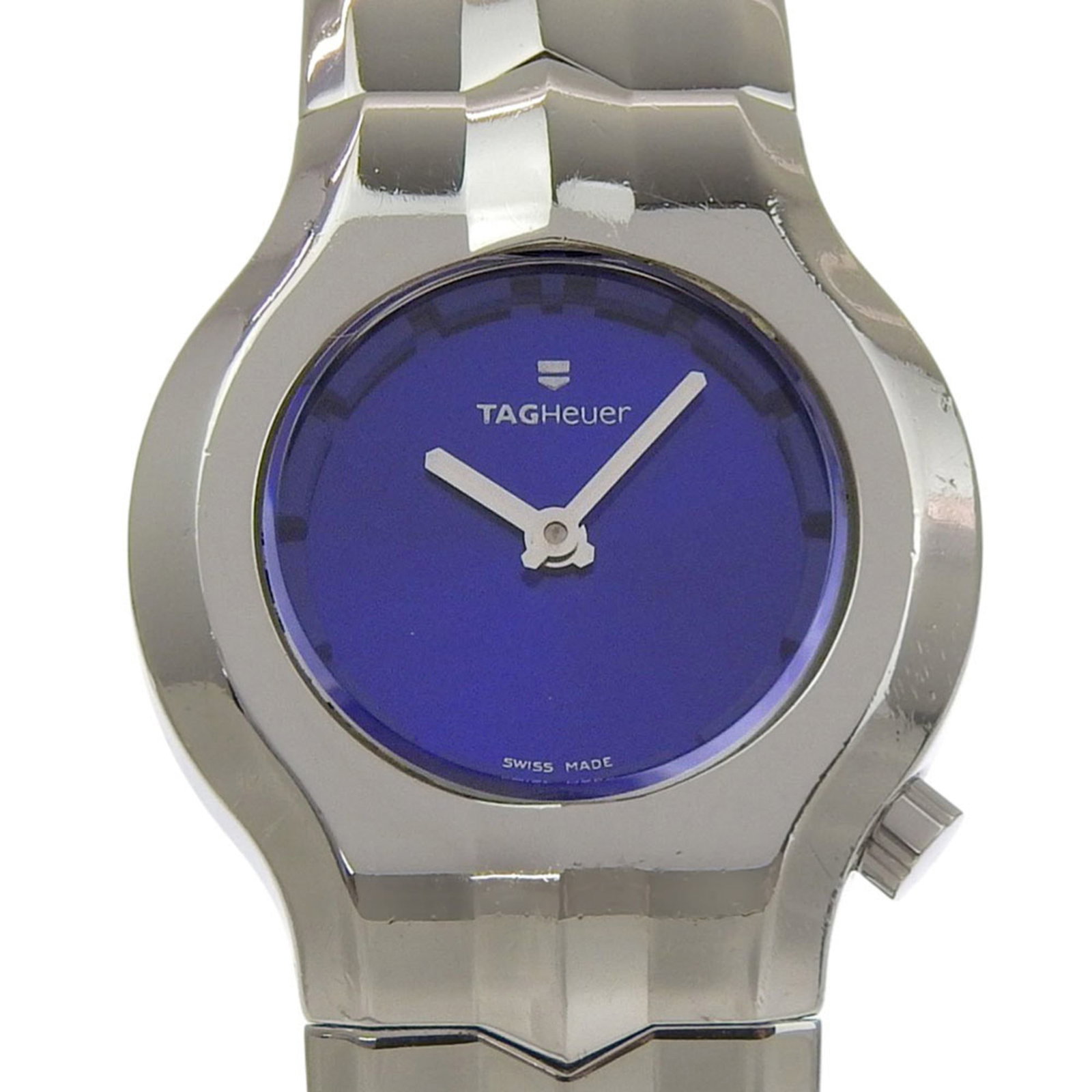 Wristwatch by Tag Heuer: Wristwatch by Tag Heuer Stainless steel case and band, the Tag Heuer wristwatch boasts a sleek blue dial. Measuring 25mm in diameter, it suits wrists up to 16cm in length. With traces of usage visible