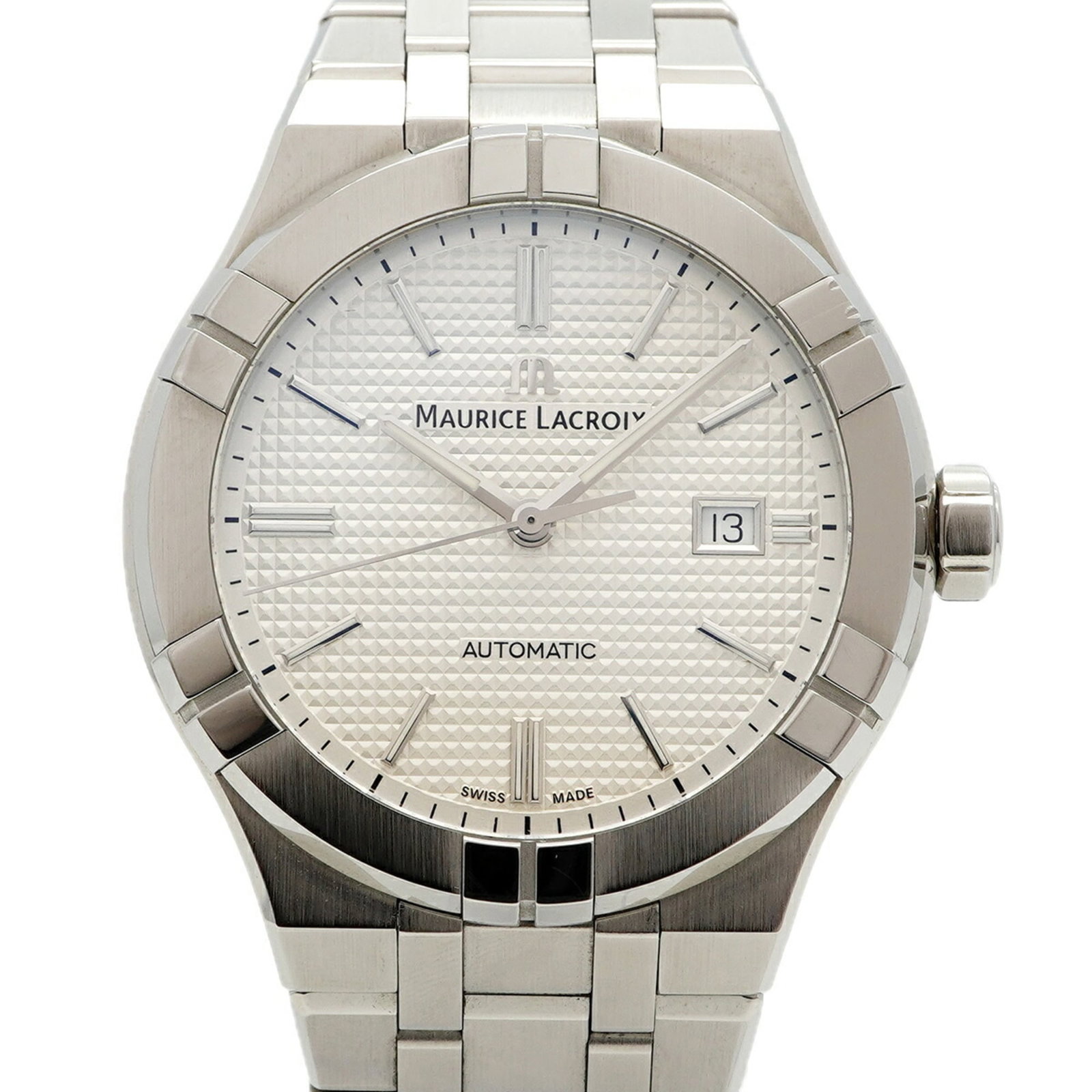 Maurice Lacroix Wristwatch: Maurice Lacroix Wristwatch Stainless steel band and 42.3mm case diameter make for a sleek, modern design. The watch bears some traces of usage, with minor scratches and dirt visible, but remains in ve