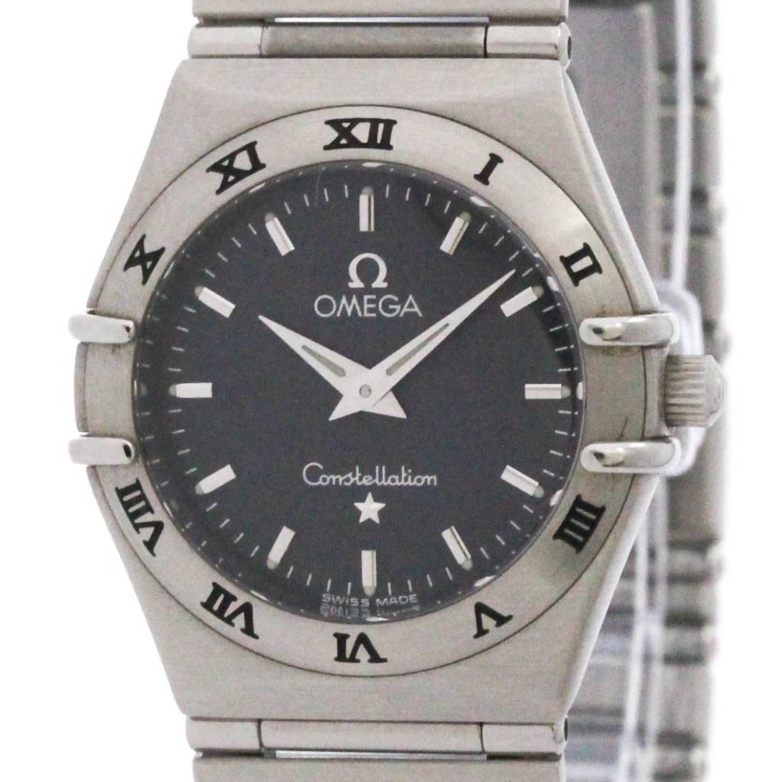 Omega Wristwatch: Omega Wristwatch Stainless steel case and band provide a durable foundation for this gray Omega wristwatch, featuring a classic dress/formal style. The watch bears some minor scratches and dirt, but r