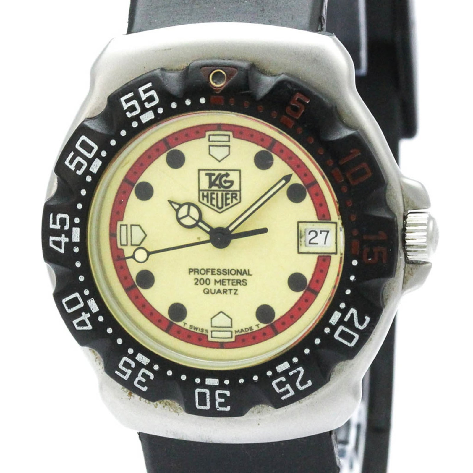 Wristwatch by Tag Heuer: Wristwatch by Tag Heuer Stainless steel case and rubber band provide a durable foundation for this sporty wristwatch, featuring an ivory dial. Measuring 35mm in diameter, the watch boasts a classic de
