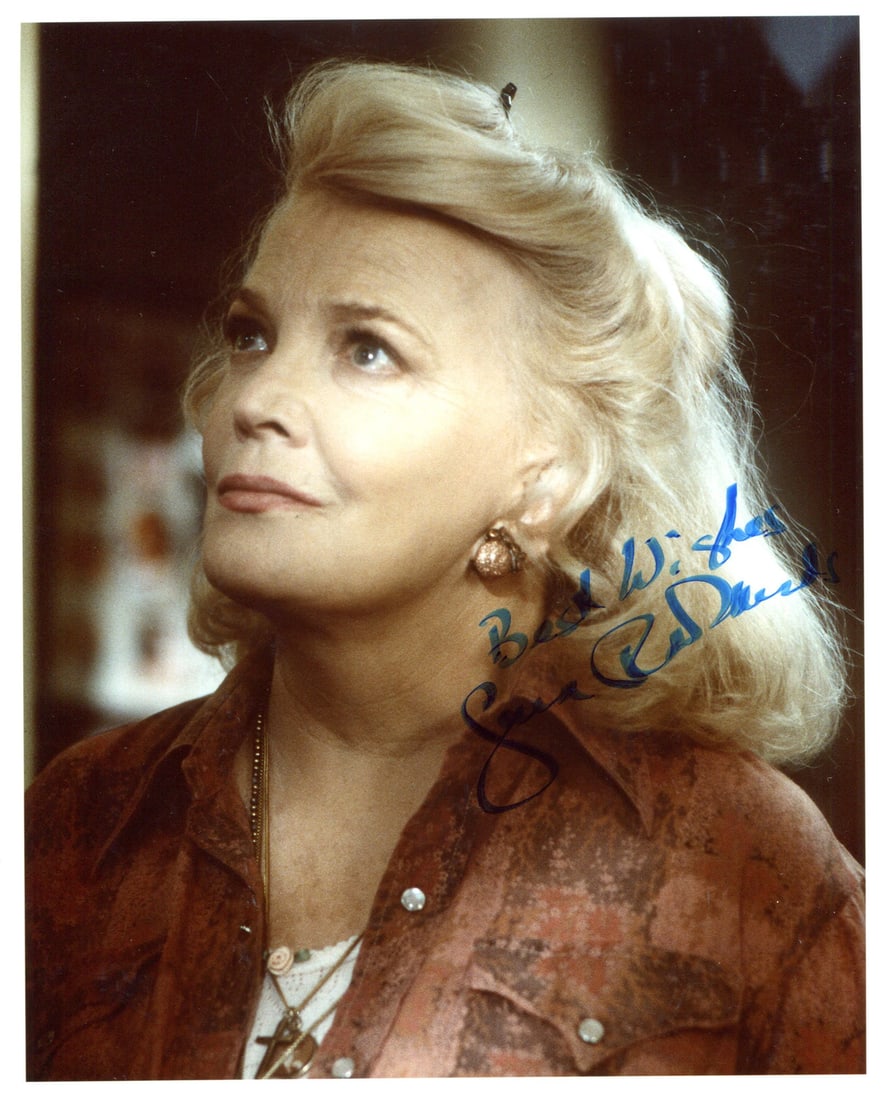 Rowlands Gena Autographed 8x10 Photo: Rowlands Gena Autographed 8x10 Photo Gena Rowlands' striking presence shines through in this 8x10 photo, bearing her signature in blue sharpie across the front. The image is accompanied by a Certifica