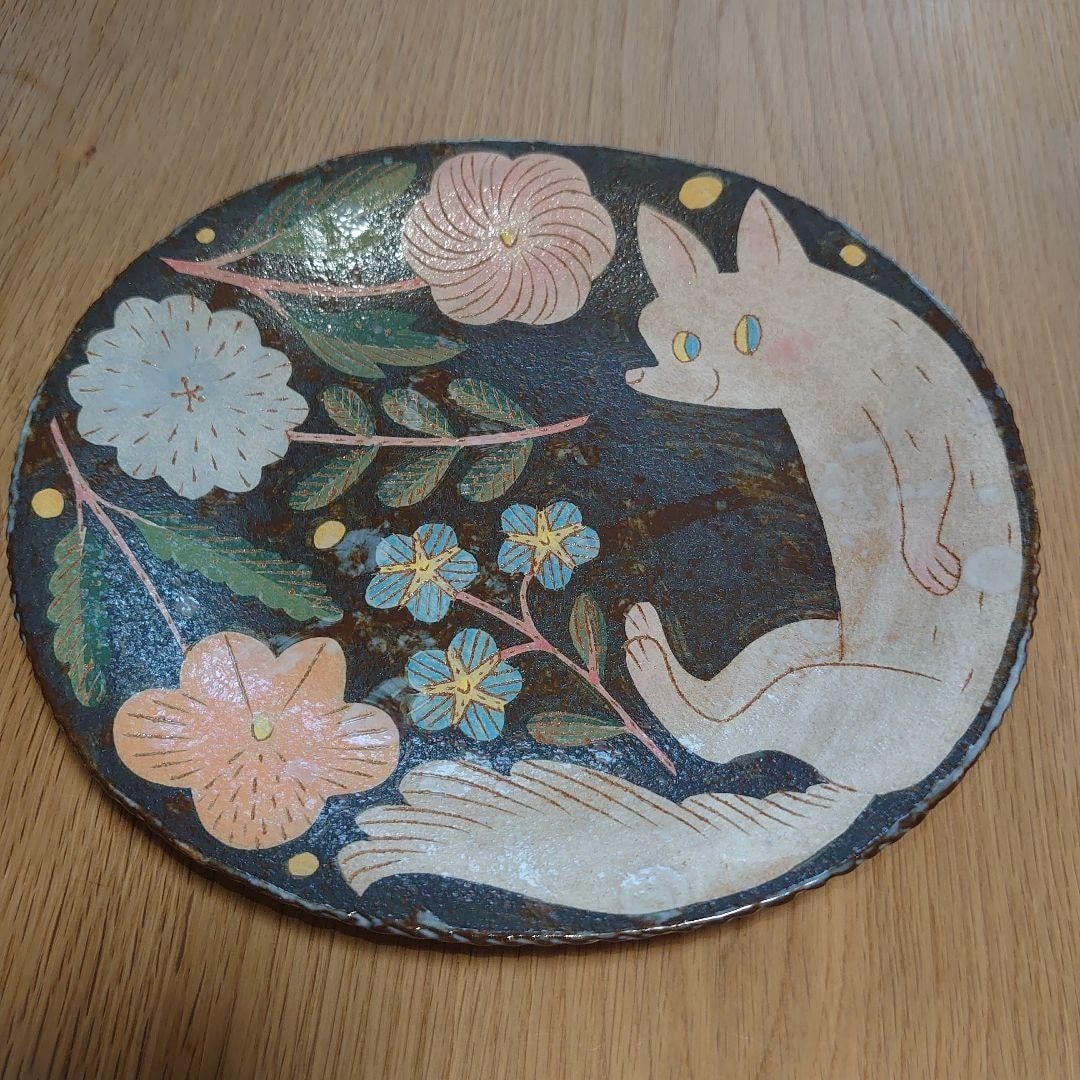 Mutsumi Signed Plate From Kagoshima: Mutsumi Signed Plate From Kagoshima The Mutsumi signed plate from Kagoshima boasts vibrant multicolor hues, showcasing the artist's mastery of realism in ceramic form. Handcrafted with care, this uniq
