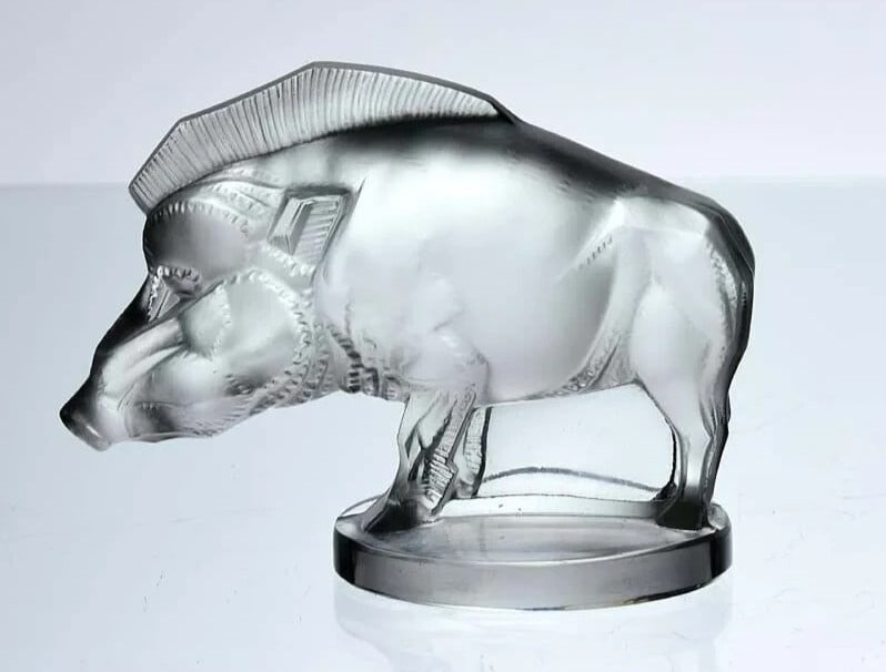 Ren Lalique Art Deco style glass car mascot "Sanglier" (Wild Boar), 1929, signe: Ren Lalique Art Deco style glass car mascot "Sanglier" (Wild Boar), 1929, signe The Sanglier, a stunning Art Deco glass car mascot from Ren Lalique's 1929 collection, boasts its original clear glass w