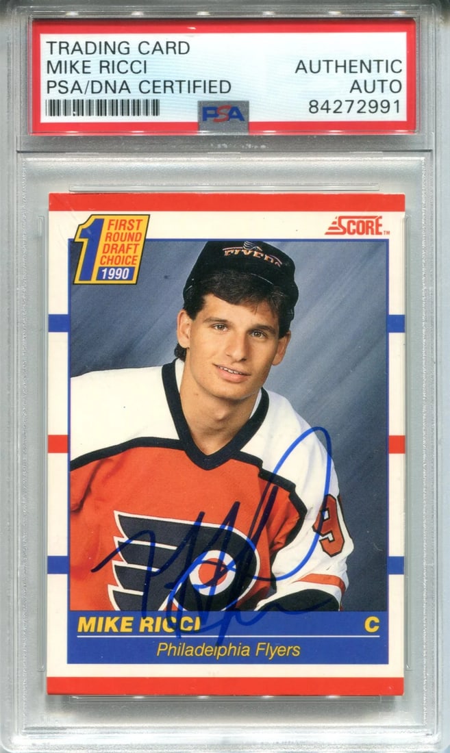 Score Card Autographed by PSA Mike Ricci: Score Card Autographed by PSA Mike Ricci PSA Mike Ricci's sharpie signature crosses the front of this 1990 Score Card, adding a touch of nostalgia to any hockey memorabilia collection. The card has