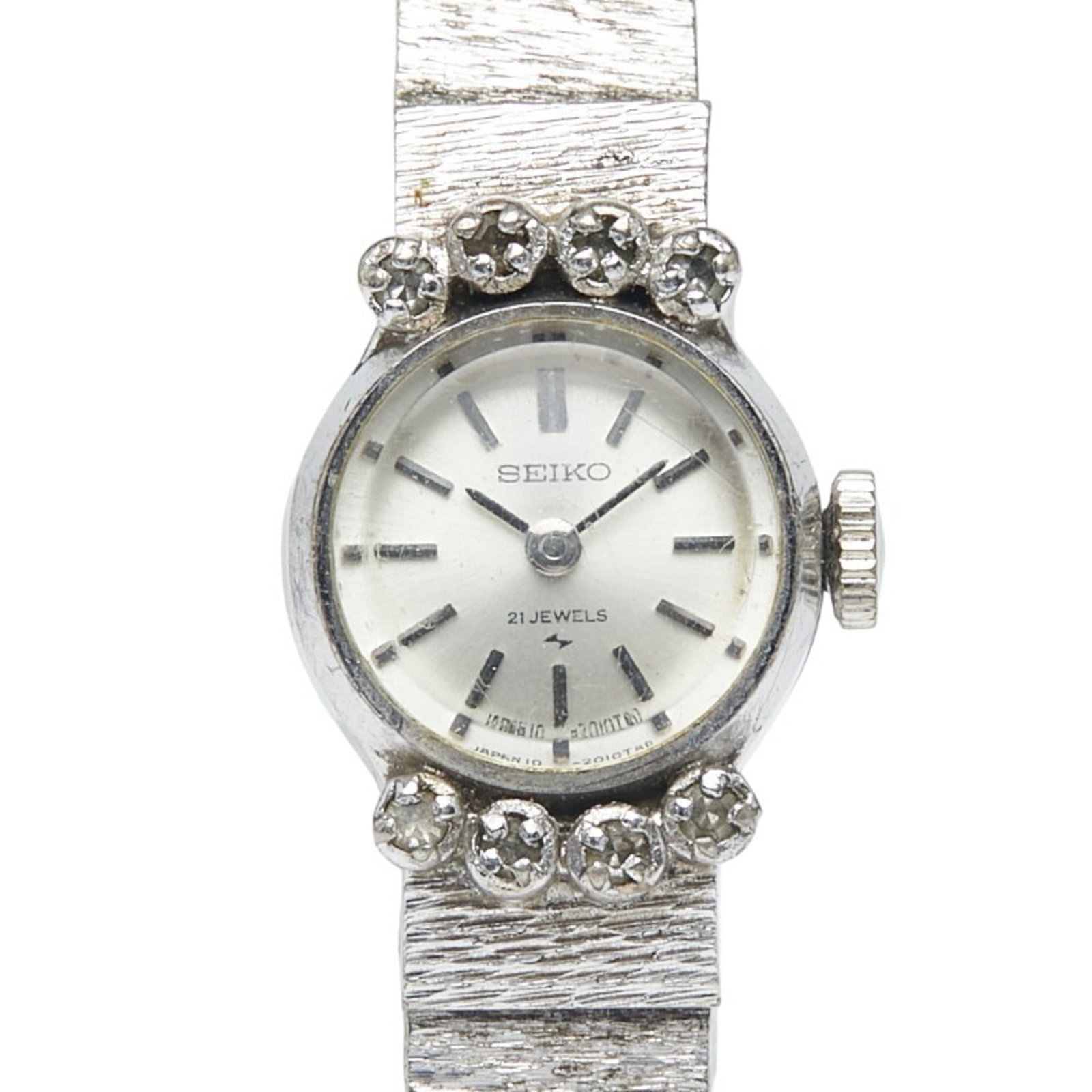 Wristwatch from Seiko: Wristwatch from Seiko Silver rhinestone-encrusted Seiko wristwatch with stainless steel case and band, measuring 16.6mm in diameter and weighing 24.3g. This used watch features a silver dial and has m