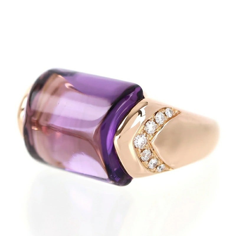 Bvlgari Musa Amethyst Diamond 18k Rose Gold Cocktail Ring US6.25 EU52 with Box: Bvlgari Musa Amethyst Diamond 18k Rose Gold Cocktail Ring US6.25 EU52 with Box 18k Rose Gold Cocktail Ring with a stunning Cabochon Amethyst and Diamond, set in a sleek Bezel design. This elegant ring