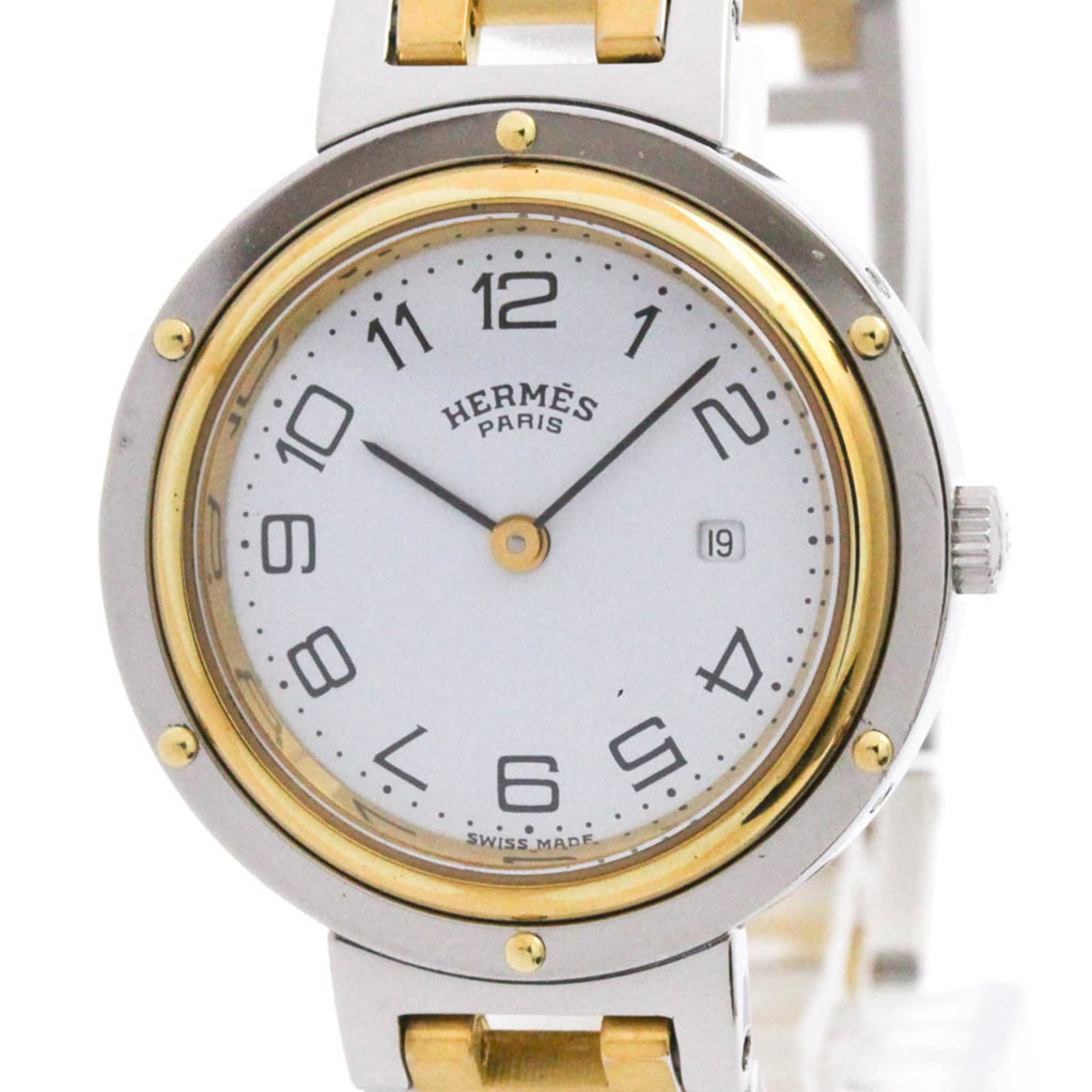 Hermes Wristwatch: Hermes Wristwatch Gold Plated, Stainless Steel Case and Band, White Dial, 30mm Diameter Watch from Hermes. This dress/formal wristwatch features a gold plated case and band with a white dial, suitable