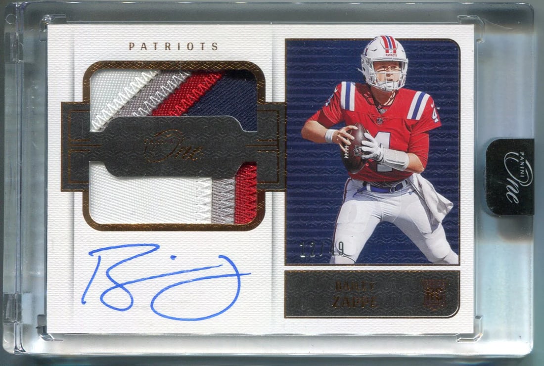 Bailey Zappe Autographed 2022 Panini One Dual Patch Rookie Card/ 49: Bailey Zappe Autographed 2022 Panini One Dual Patch Rookie Card/ 49 Signed by artist Bailey Zappe, this 2022 Panini One Dual Patch Rookie Card features two distinct patches on the front, making it a s