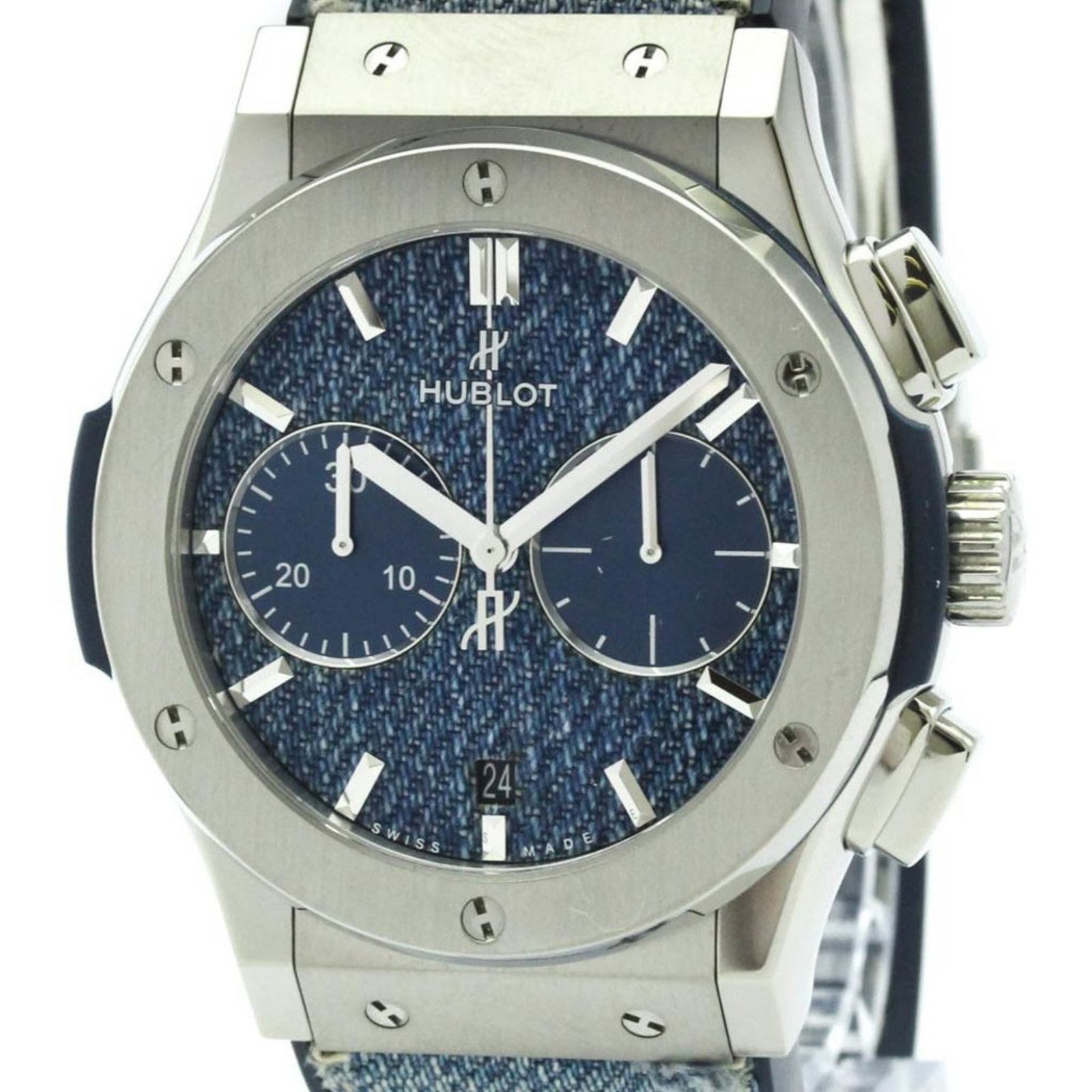 Hublot Wristwatch: Hublot Wristwatch Titanium case, 45mm diameter, and denim band make for a unique combination in this used Hublot wristwatch. The blue dial adds a touch of style to an already sporty design. With some 
