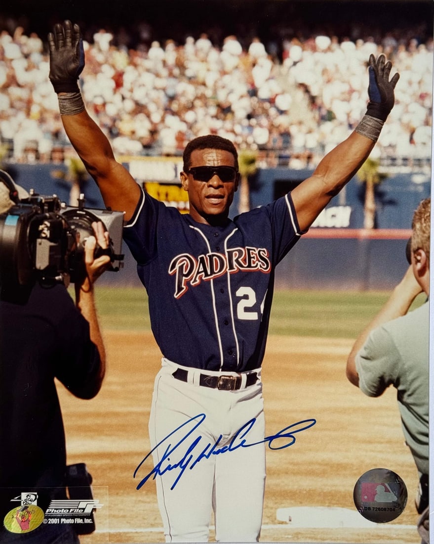 Rickey Henderson Autographed 8x10 Baseball Photo (Henderson Holo): Rickey Henderson Autographed 8x10 Baseball Photo (Henderson Holo) Signed in blue sharpie across the front, this 8x10 baseball photo showcases Rickey Henderson's signature. The item bears his autograph