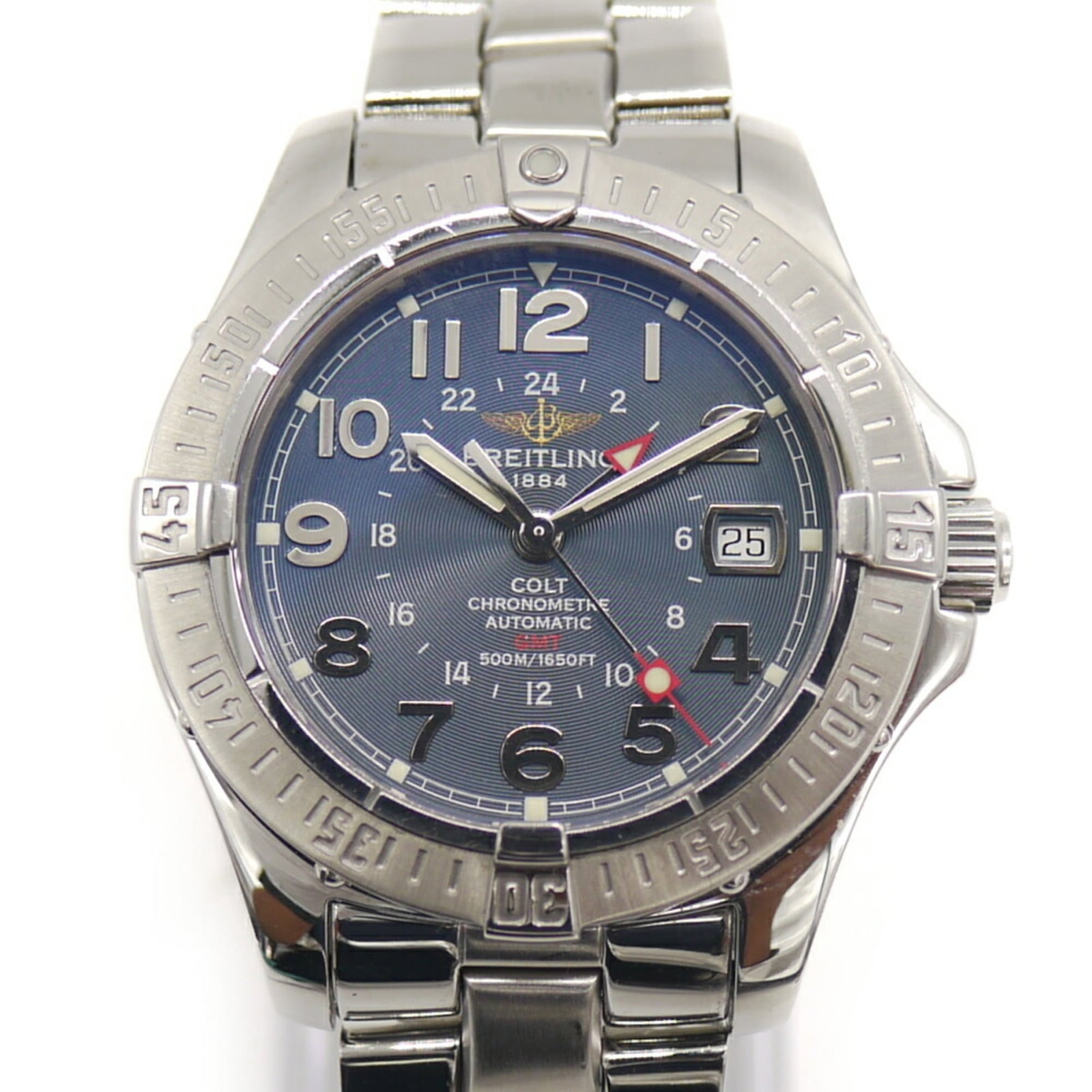 Breitling Wristwatch: Breitling Wristwatch Stainless steel case and band, the Breitling wristwatch boasts a sleek 40mm diameter with a striking blue dial. Featuring sapphire crystal protection, this timepiece offers durabi