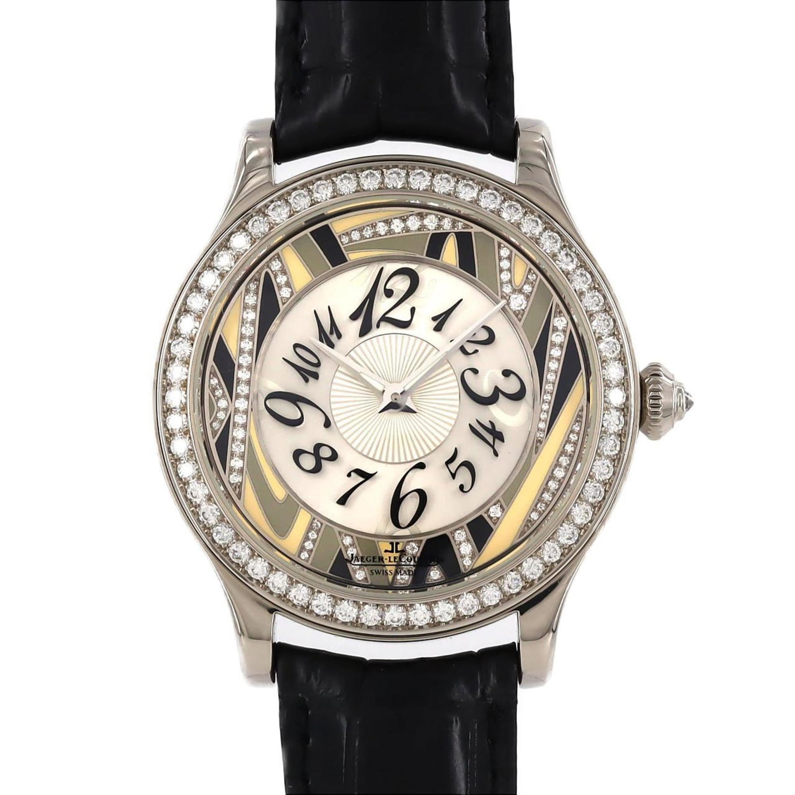 Jaeger Lecoultre Wristwatch: Jaeger Lecoultre Wristwatch Jaeger Lecoultre's iconic wristwatch boasts a sleek, silver dial set against a white gold case. With its classic design and subtle scratches from years of wear, this timepi
