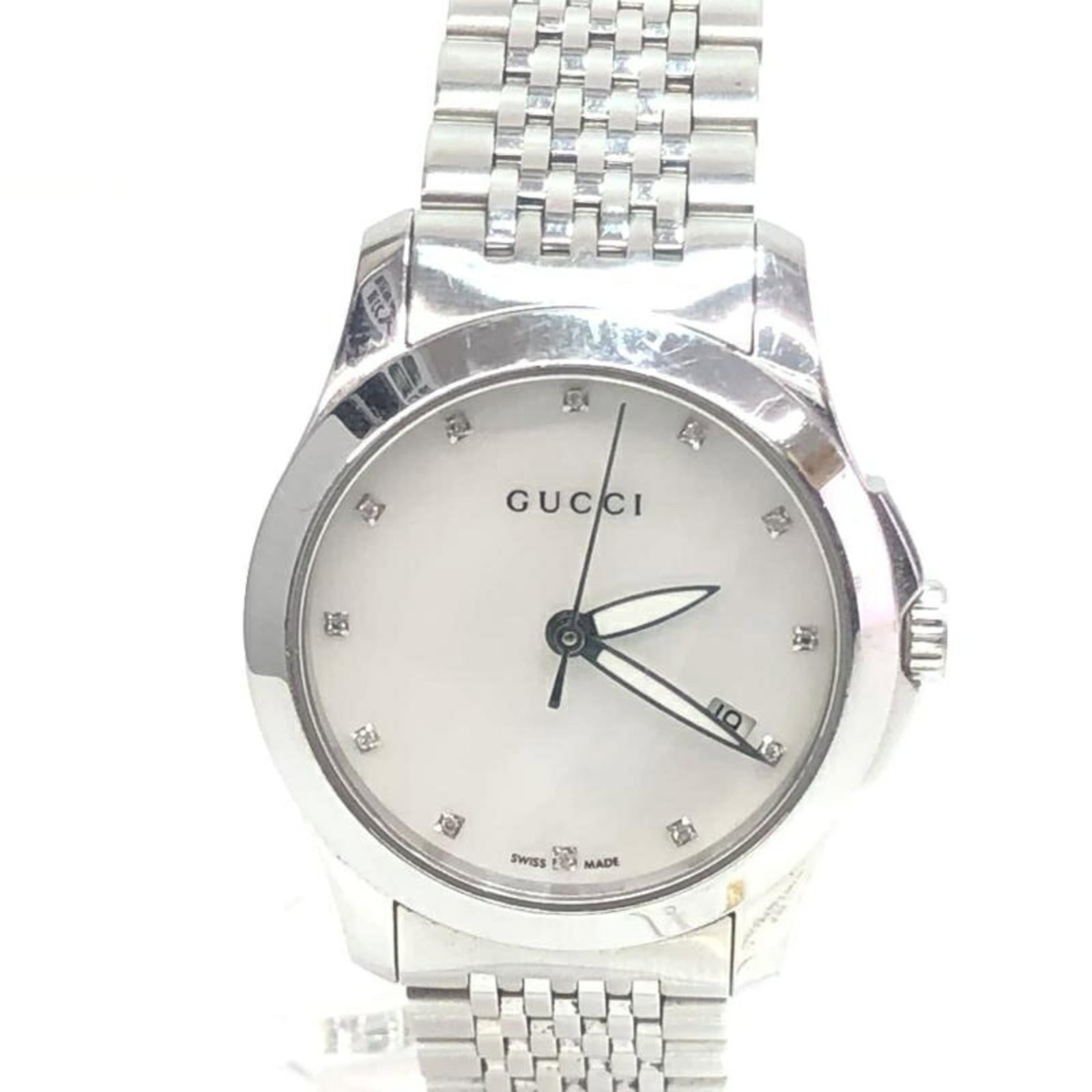Gucci Wristwatch: Gucci Wristwatch This Gucci wristwatch boasts a sleek design with a 27mm case diameter, making it a stylish accessory for those who appreciate classic elegance. With its durable construction and subtl