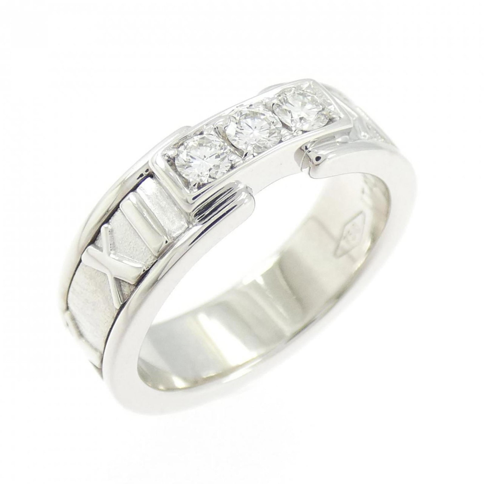 White Gold Tiffany Band Ring 18K: White Gold Tiffany Band Ring 18K White Gold Tiffany Band Ring 18K features an 18k white gold band with diamond accents, showcasing a classic design. The ring bears a signature and has been carefully c