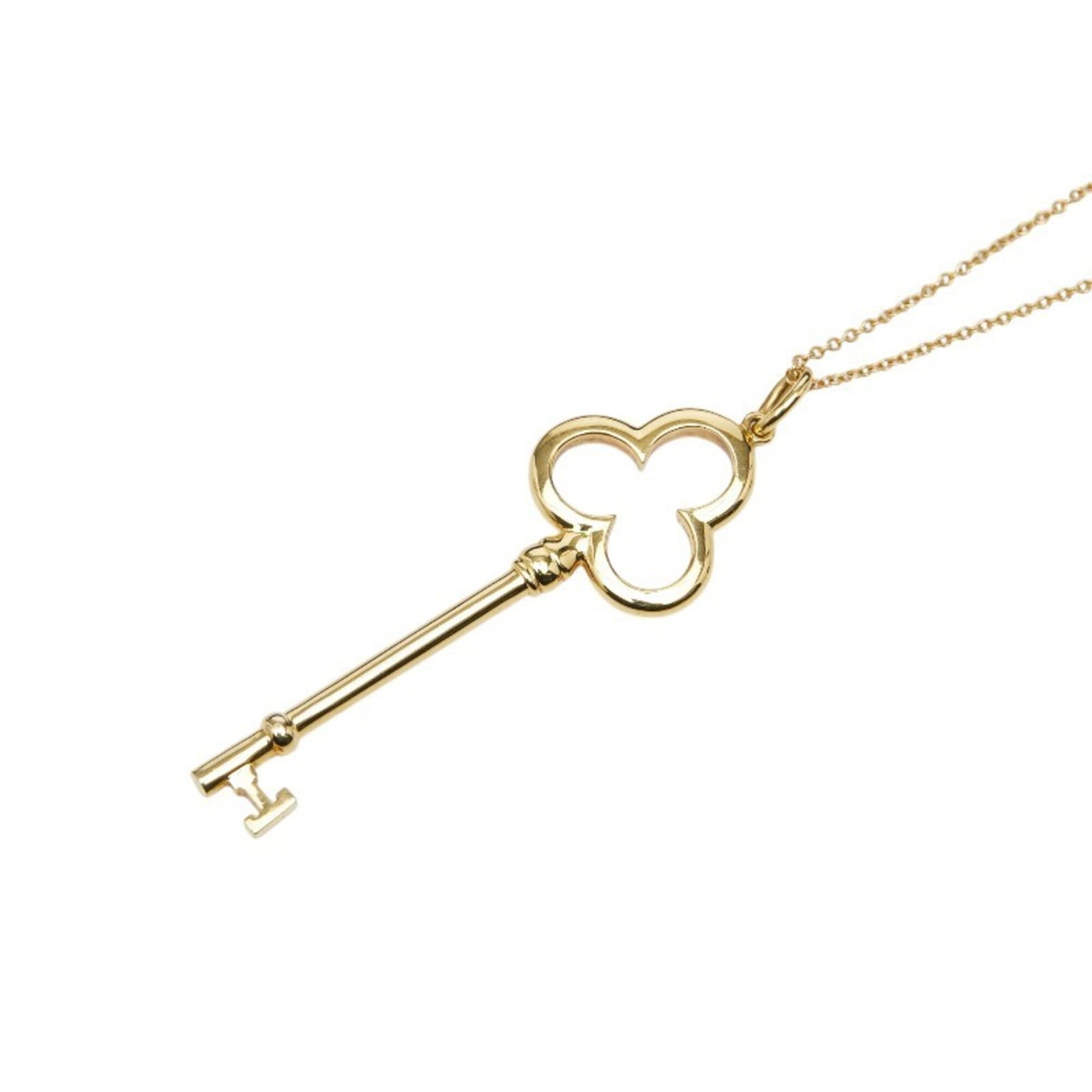 Tiffany & Co. Trefoil Key Necklace 18K Yellow Gold Women'S.: Tiffany & Co. Trefoil Key Necklace 18K Yellow Gold Women'S. Tiffany & Co. Trefoil Key Necklace in 18K Yellow Gold features a classic design with intricate details, showcasing the iconic trefoil