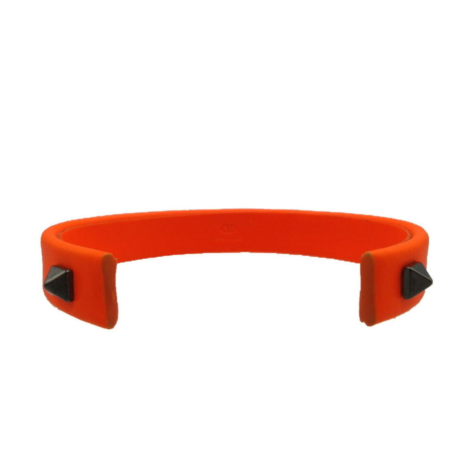 Rubber Valentino Bangle: Rubber Valentino Bangle Black and orange rubber bangle from Valentino, measuring 21.5cm in length, bearing a signature. This rubber bangle has hardly any traces of usage and is presented as used but l